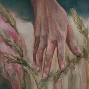 Hand study with wheat field